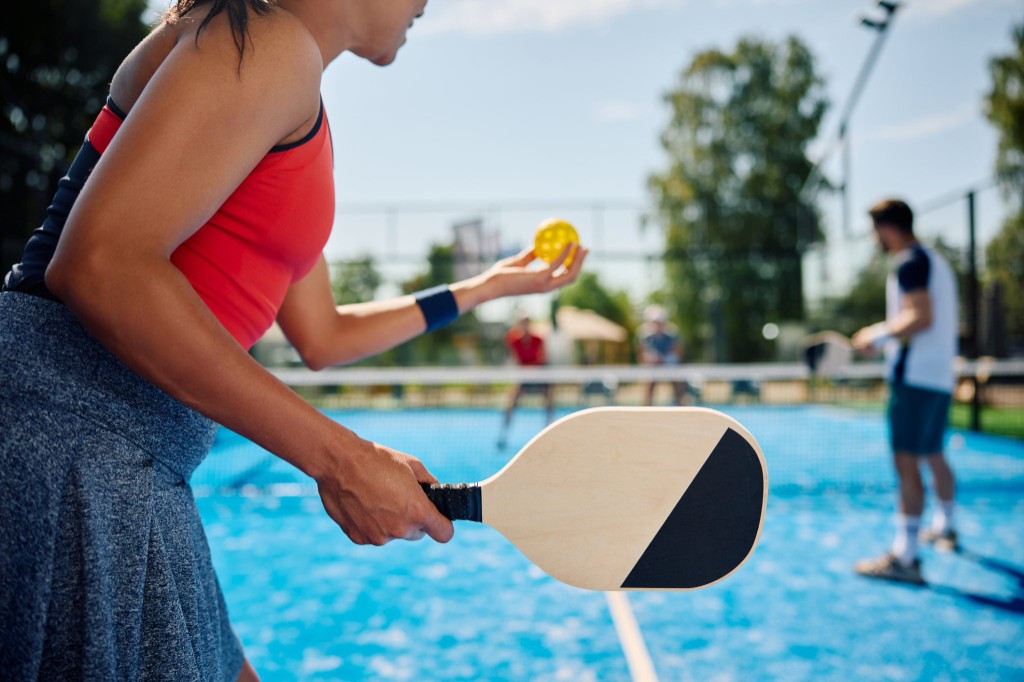 Players on a clean outdoor pickleball court
